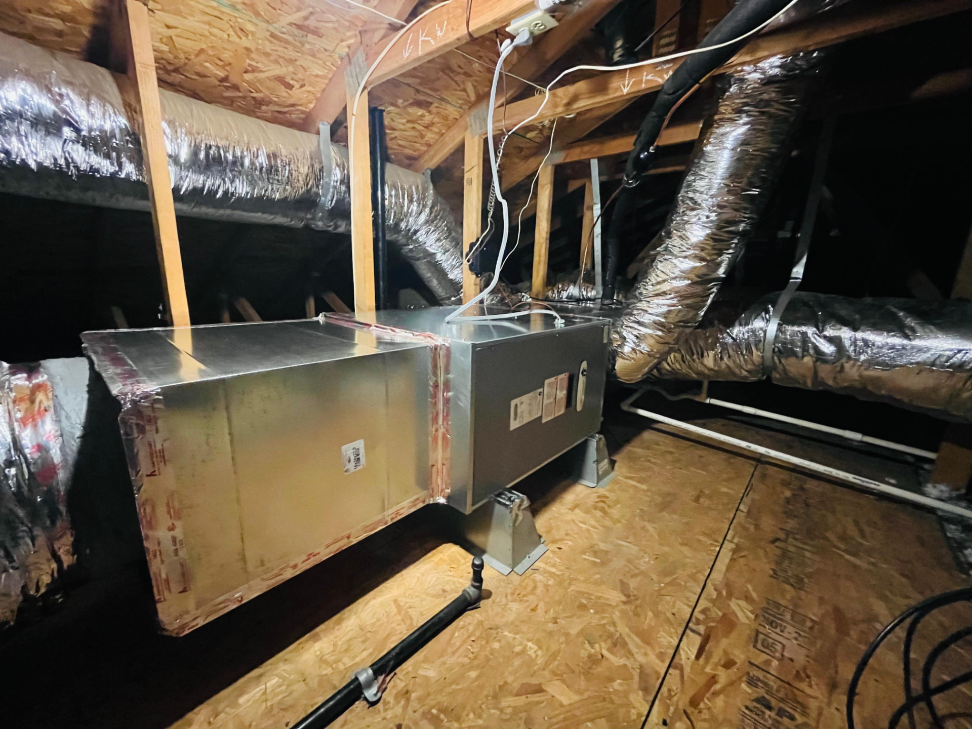 Attic air handler and ductwork installed by Bloom Comfort
